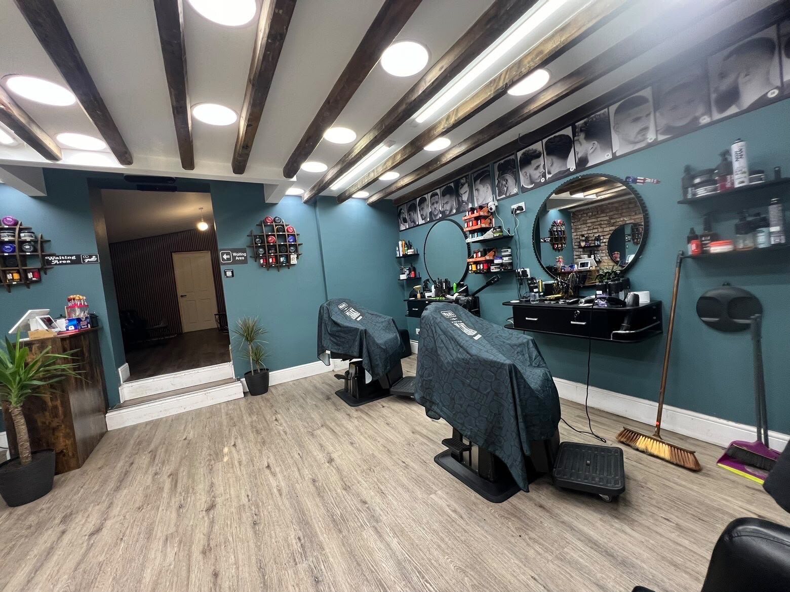 Two further barber chairs and workstations inside the shop